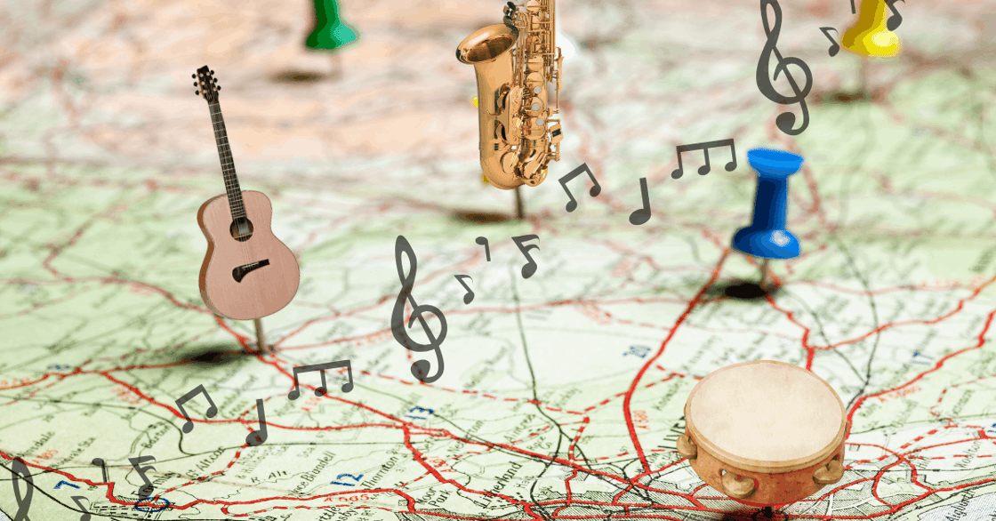 A map with several musical instrument pins stuck into it, including a drum, saxophone, and guitar.