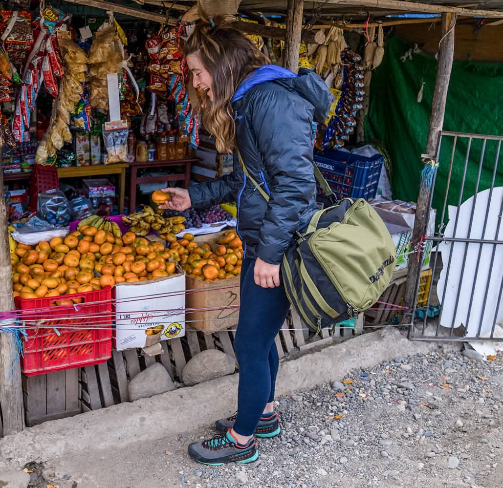 Patagonia. A person shops for produce at a street stall.