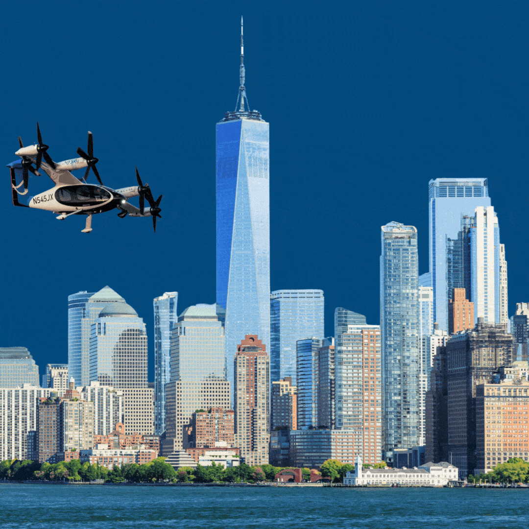 A Joby aircraft flying across a cityscape.